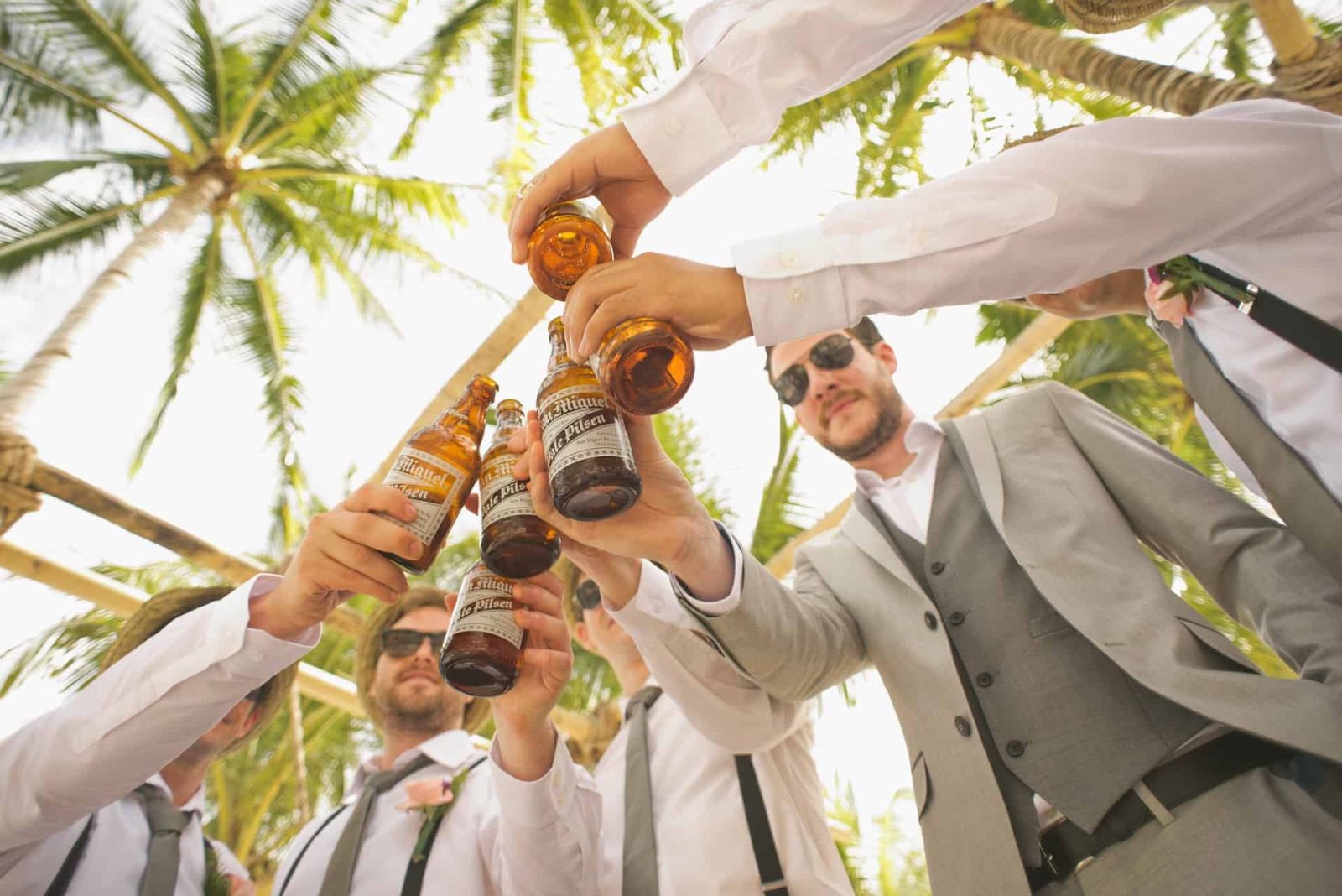 groom friends holding beer in a bachelor party